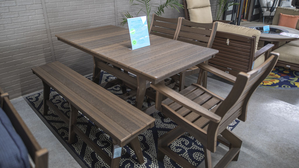 6 person modern poly dining with swivels and bench in wood texture. champaign il store