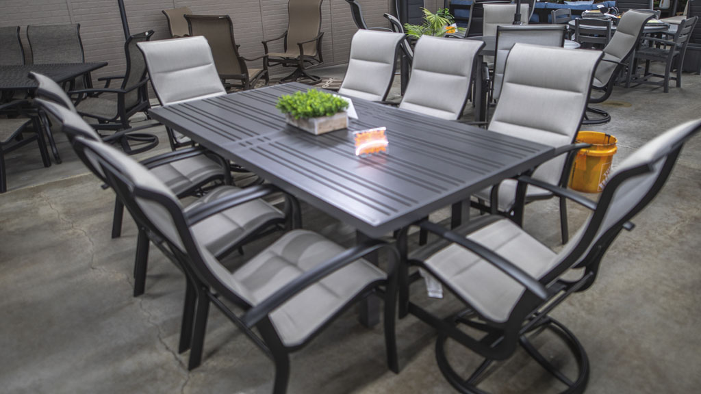 8 person extruded aluminum dining set with padded sling chairs and large rectangle table. champaign il store