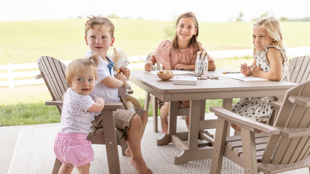 Children playing seated at luxury kids dining set. Best in Illinois & Midwest.